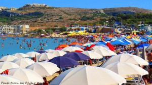 too many umbrellas on the beach mellieha bay philip zammit