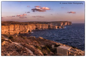 cliffs at dwejra gozo bathed in the warm glow of sunset joanne mohr