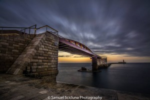 early morn Moody skies over the Break water bridge at sunrise samuel scicluna photography