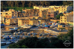 mgarr harbour bathed in the warm glow of sunrise peter mohr